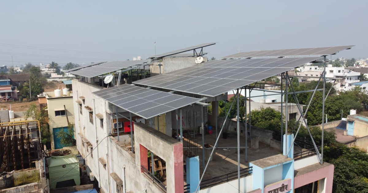 Elevated rooftop solar panels at a Conservit installation
